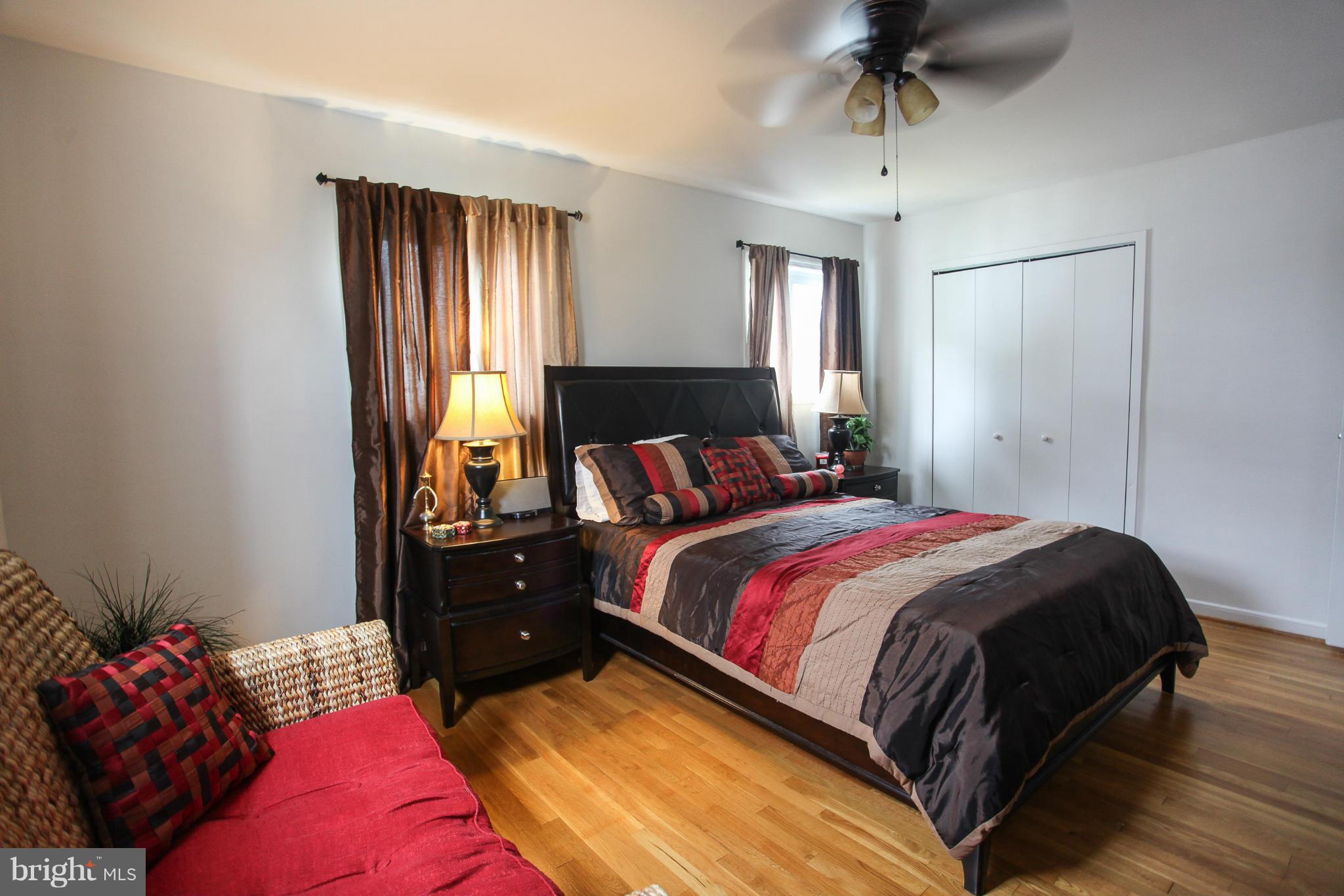 938 Vanderwood Road Baltimore, MD 21228 - Photo 19 of 26 a bedroom with a bed and closet