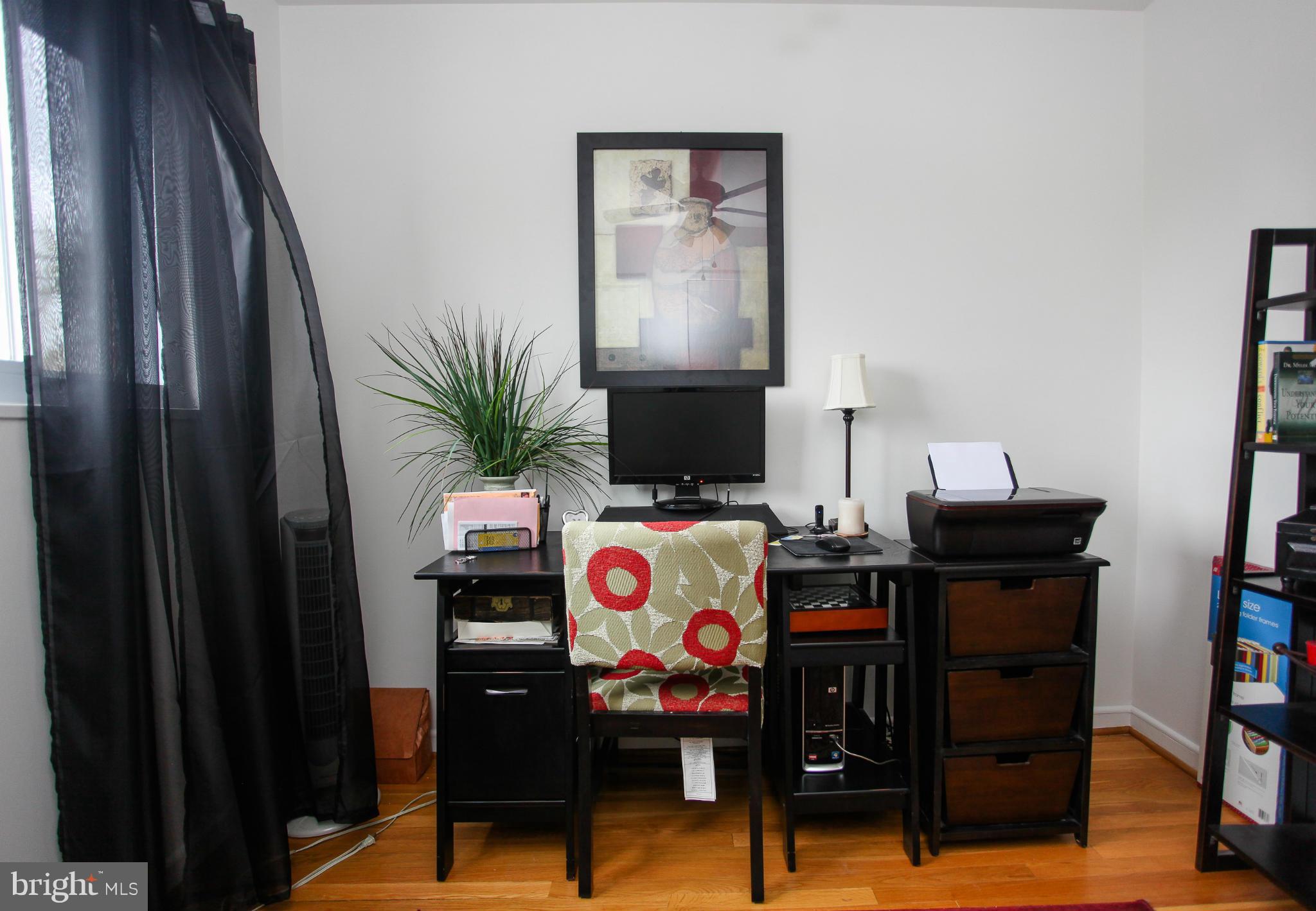 938 Vanderwood Road Baltimore, MD 21228 - Photo 20 of 26 a living room with furniture and flat screen tv