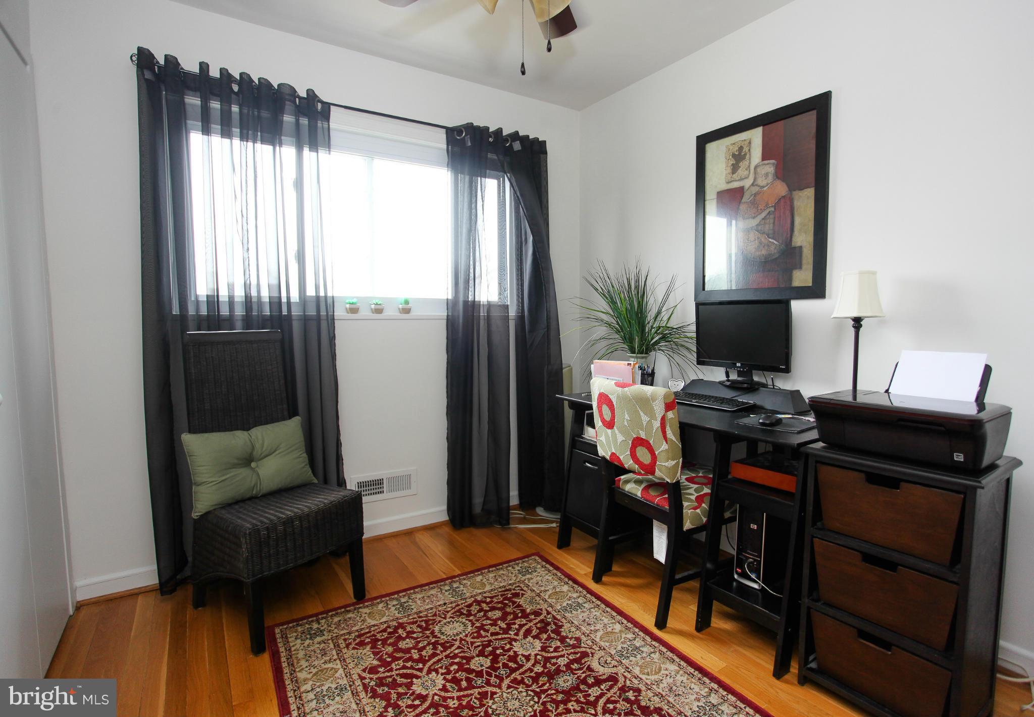 938 Vanderwood Road Baltimore, MD 21228 - Photo 21 of 26 a living room with furniture and a window