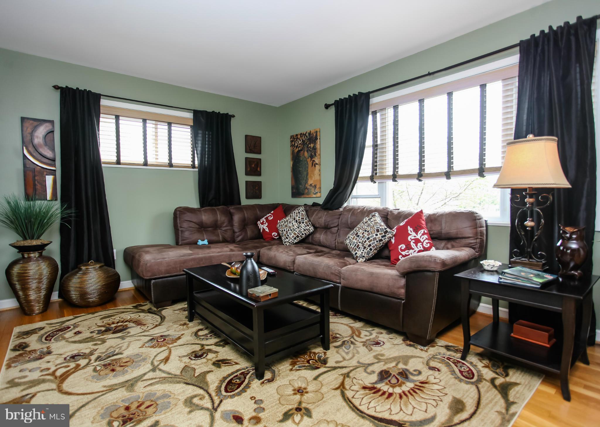 938 Vanderwood Road Baltimore, MD 21228 - Photo 4 of 26 a living room with furniture and a window
