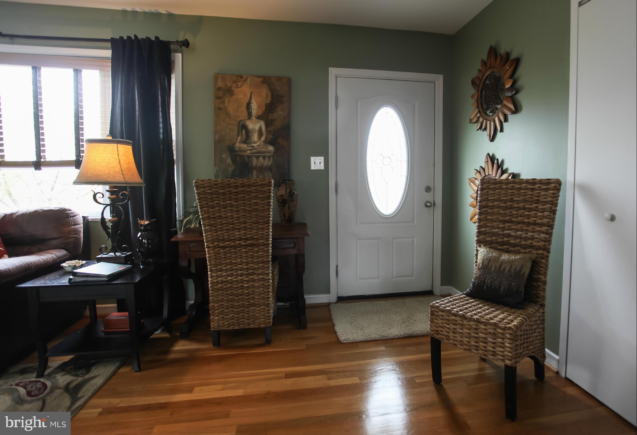 938 Vanderwood Road Baltimore, MD 21228 - Photo 6 of 26 a living room with furniture and a potted plant