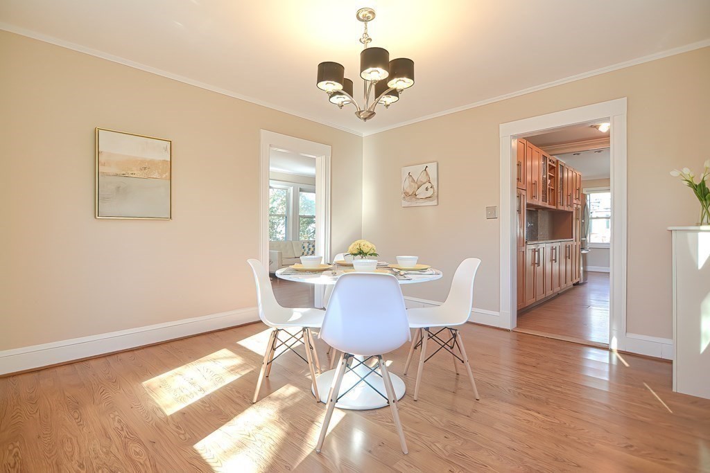 39 Pine Crest Road Newton, MA 02459 - Photo 14 of 39 a view of a dining room with furniture a chandelier and wooden floor