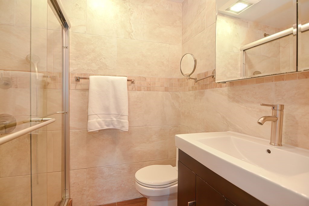39 Pine Crest Road Newton, MA 02459 - Photo 18 of 39 a bathroom with a sink a toilet and shower
