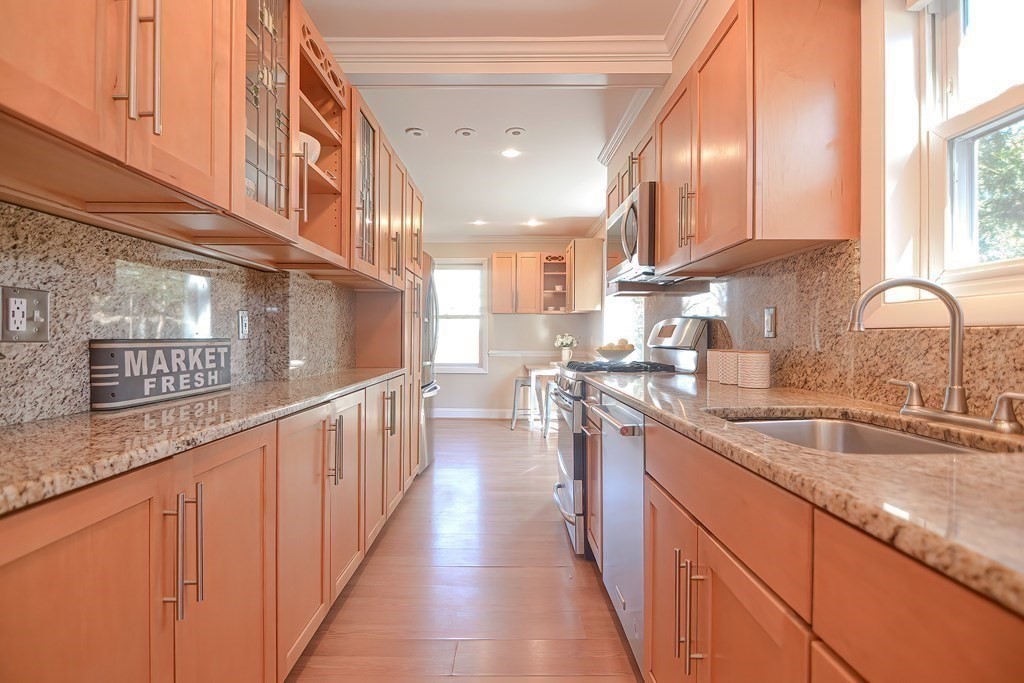 39 Pine Crest Road Newton, MA 02459 - Photo 10 of 39 a kitchen with counter top space a sink and cabinets