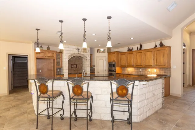 a room with lots of chairs and mirrors