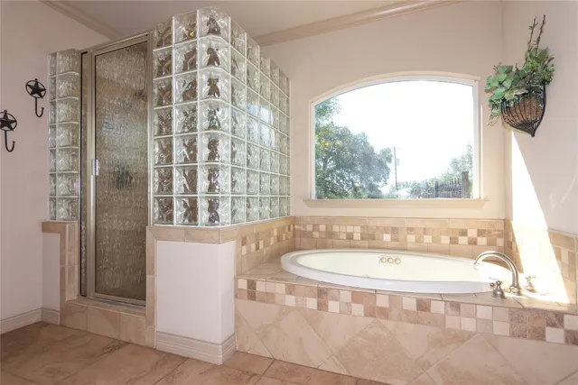 a bathroom with a bathtub and a sink