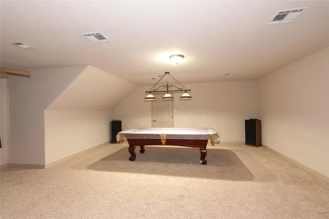a bedroom with furniture and a chandelier