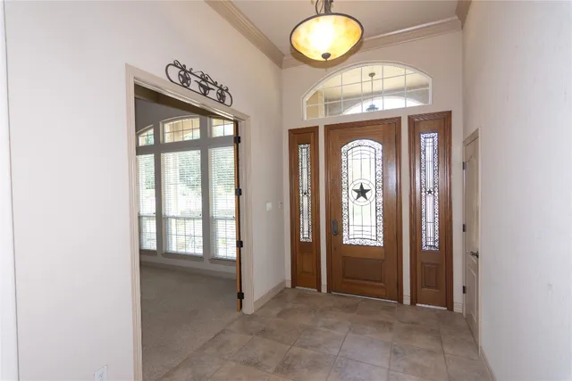 an entryway view with a wooden door