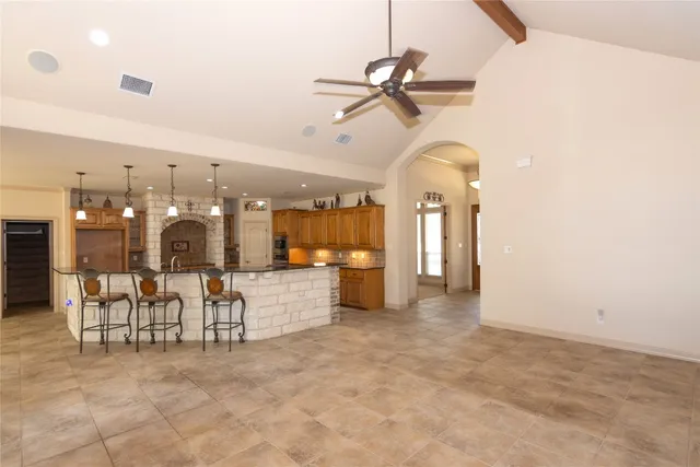 a large room with chandelier furniture and windows
