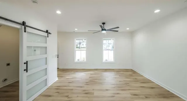 a view of an empty room with a window