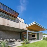 a view of a house with backyard and porch