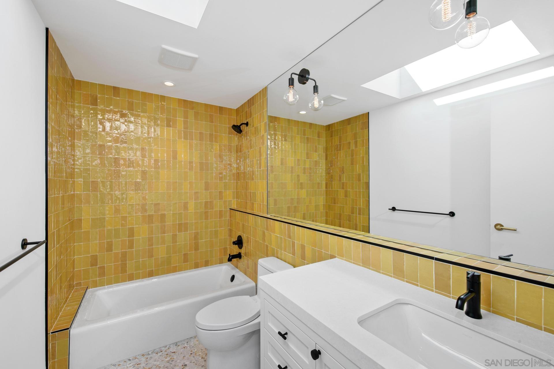 664 Cornish Drive Encinitas, CA 92024 - Photo 21 of 46 a bathroom with a sink a toilet and shower