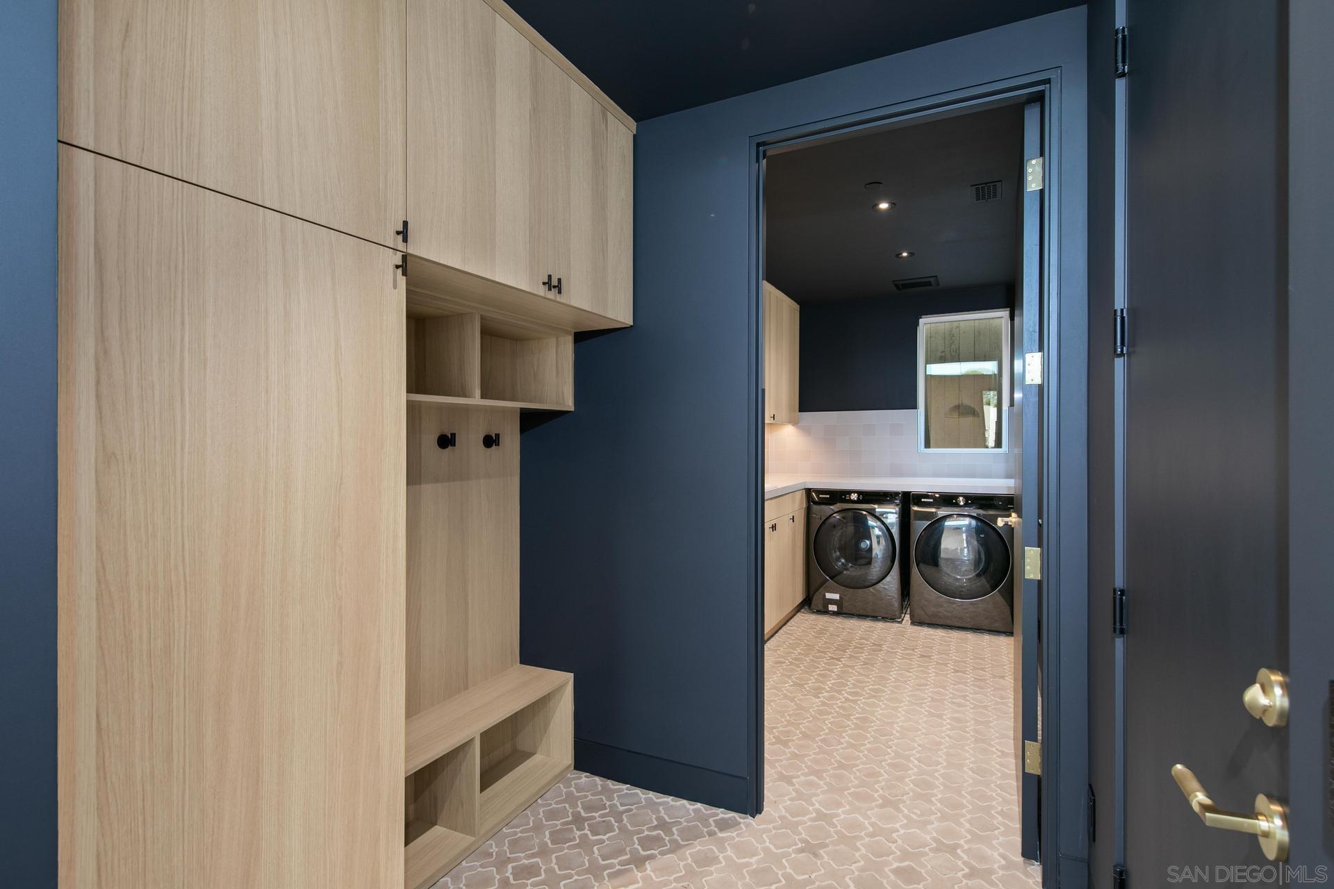 664 Cornish Drive Encinitas, CA 92024 - Photo 26 of 46 a view of a hallway with wooden floor and staircase