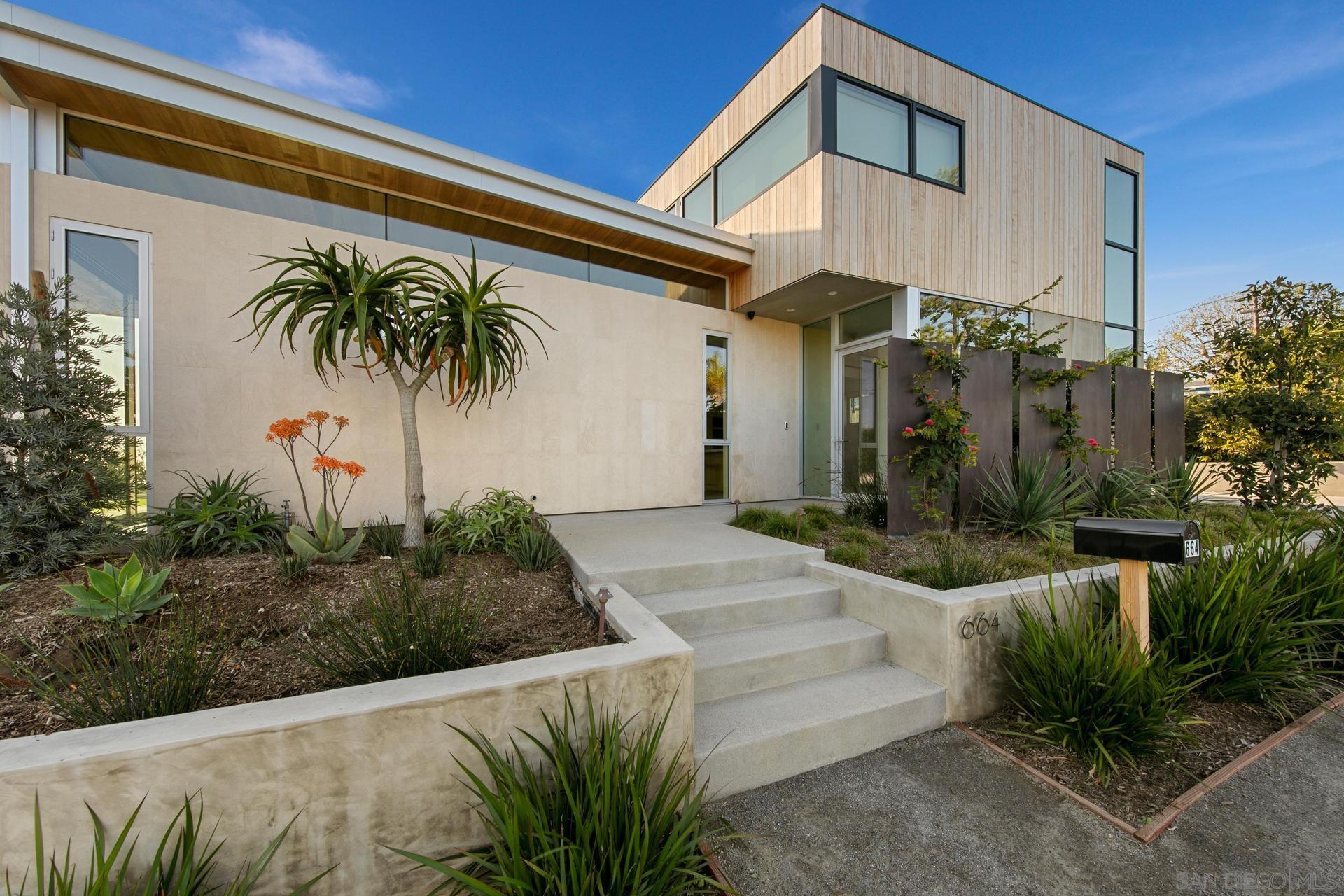 664 Cornish Drive Encinitas, CA 92024 - Photo 33 of 46 a front view of a house with garden