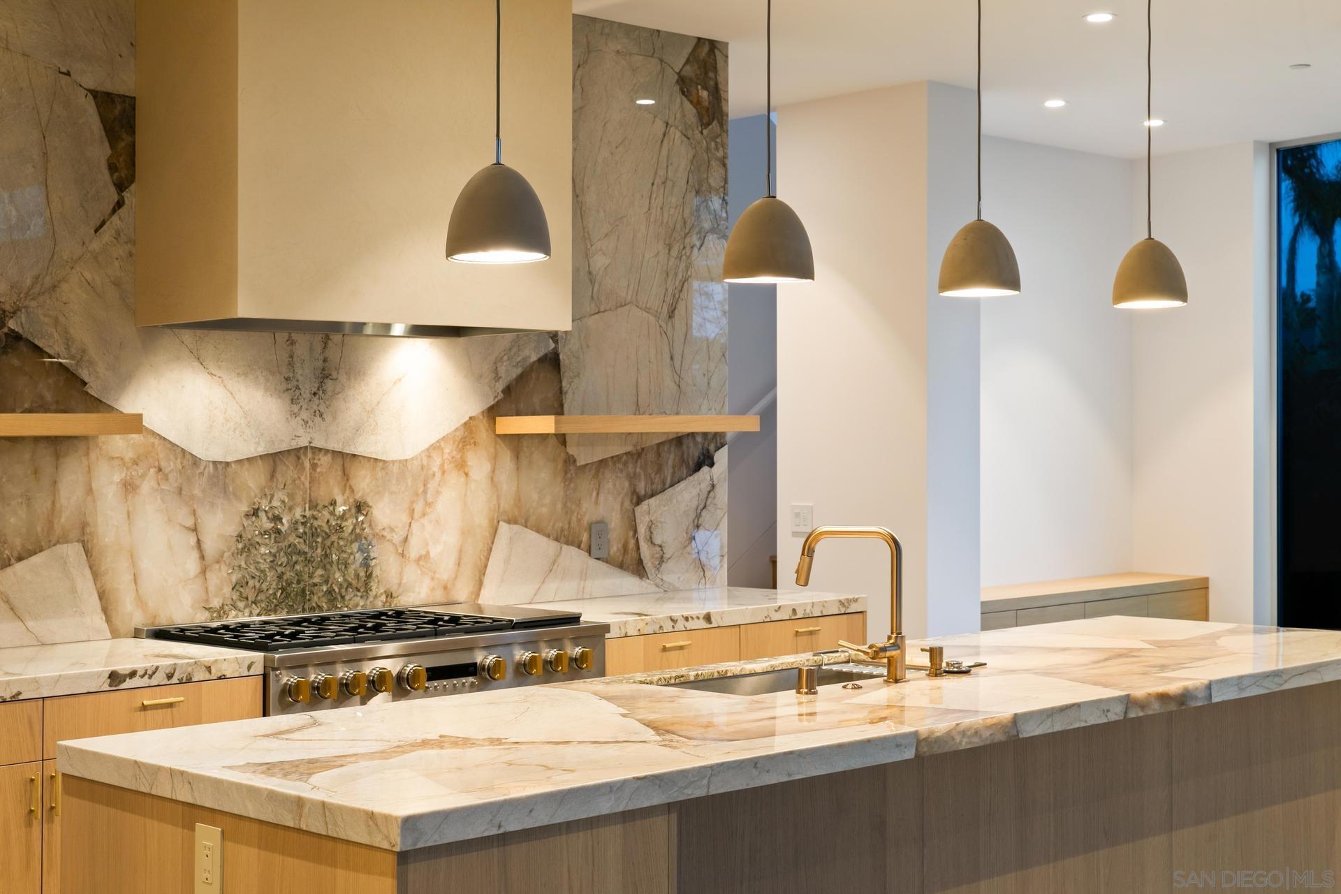 664 Cornish Drive Encinitas, CA 92024 - Photo 41 of 46 a kitchen with a stove and a sink