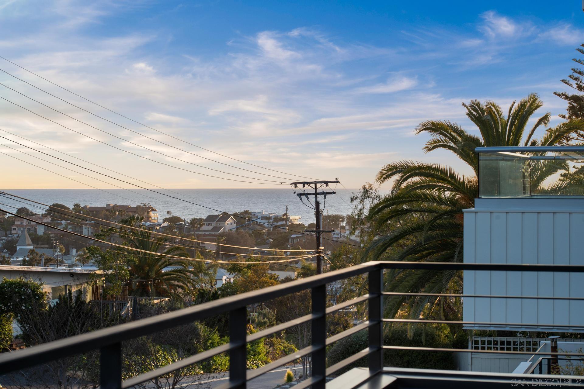 664 Cornish Drive Encinitas, CA 92024 - Photo 44 of 46 a view of a balcony with a forest
