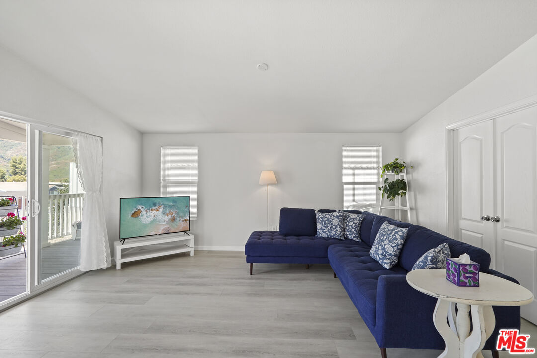 30473 Mulholland Highway, Unit 174 Agoura Hills, CA 91301 - Photo 11 of 36 a living room with furniture and wooden floor