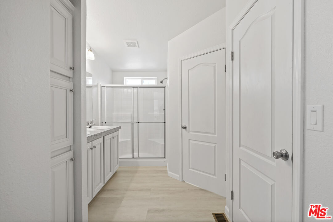 30473 Mulholland Highway, Unit 174 Agoura Hills, CA 91301 - Photo 17 of 36 a view of a hallway with white doors
