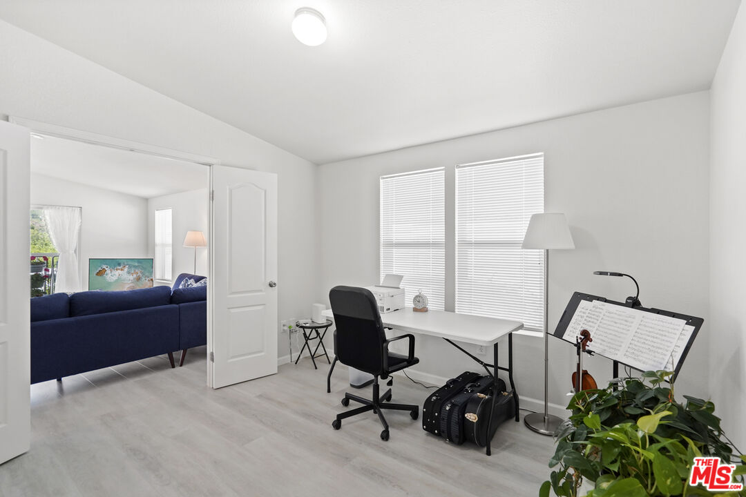 30473 Mulholland Highway, Unit 174 Agoura Hills, CA 91301 - Photo 20 of 36 a view of a workspace with furniture and a window