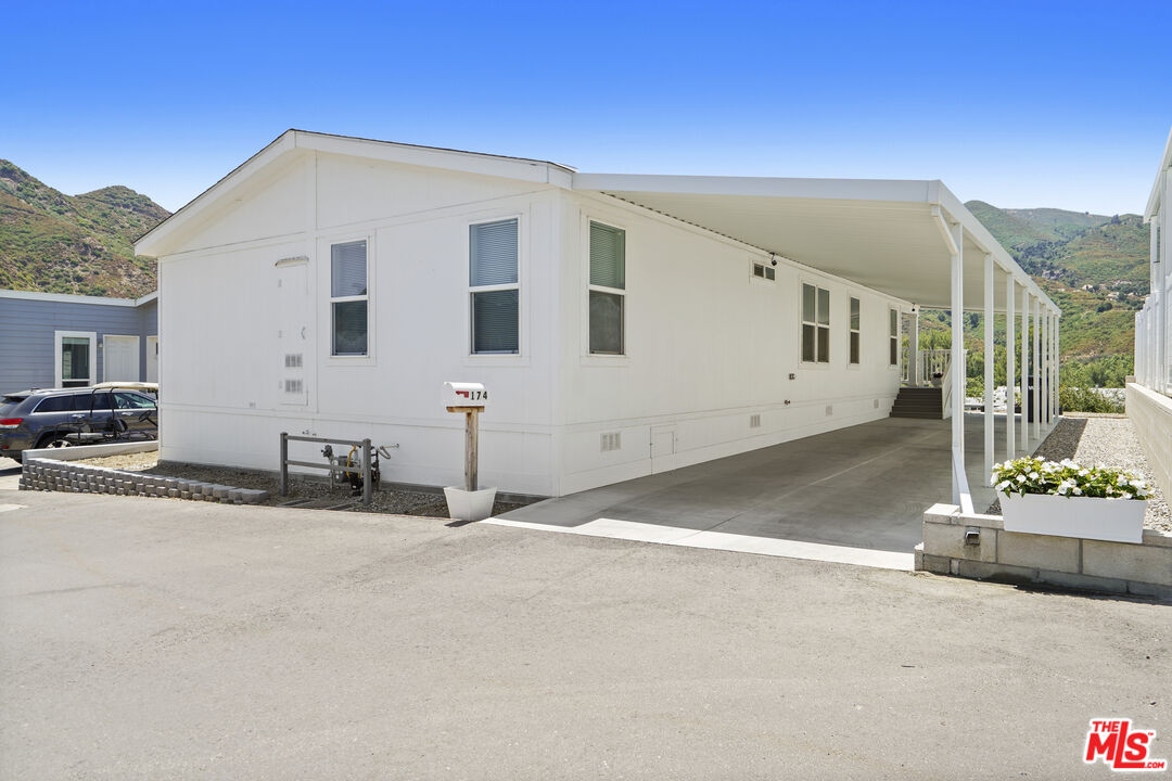 30473 Mulholland Highway, Unit 174 Agoura Hills, CA 91301 - Photo 2 of 36 a view of a house with a street
