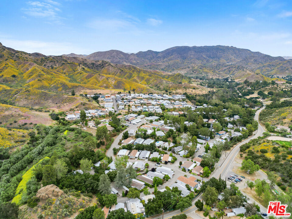 30473 Mulholland Highway, Unit 174 Agoura Hills, CA 91301 - Photo 27 of 36 a view of a town with mountains in the background