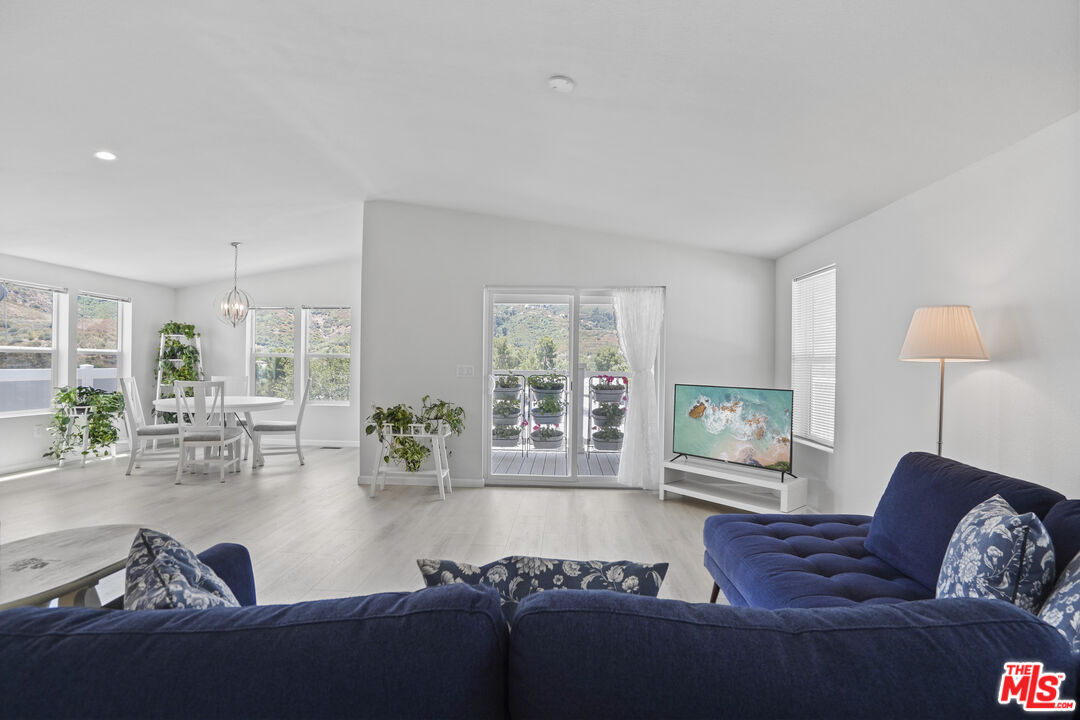 30473 Mulholland Highway, Unit 174 Agoura Hills, CA 91301 - Photo 7 of 36 a living room with furniture and a large window