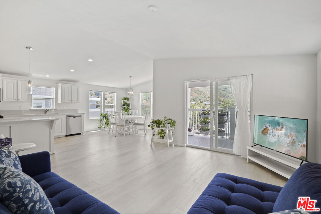 30473 Mulholland Highway, Unit 174 Agoura Hills, CA 91301 - Photo 8 of 36 a living room with furniture and a large window