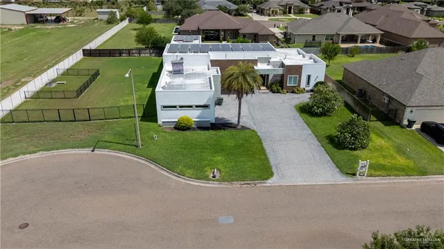 an aerial view of a house with a garden