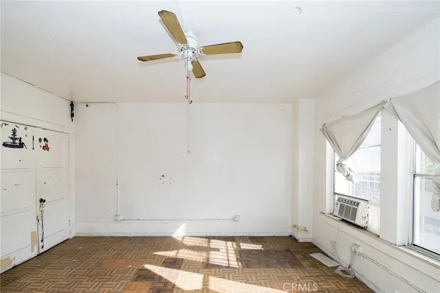 a room with window and furniture