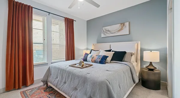 a bedroom with bed and a window