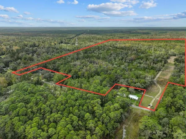 a view of a lake with a yard and lake