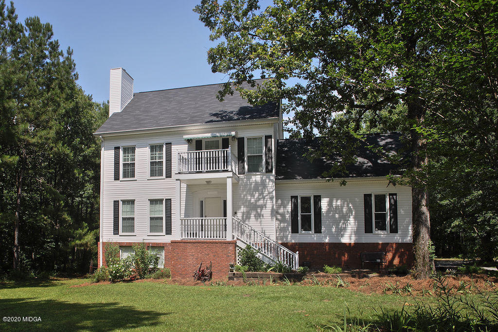 411 Lamar Road Macon, GA 31220 - Photo 2 of 22 a front view of a house with a yard