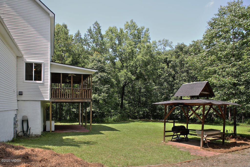 411 Lamar Road Macon, GA 31220 - Photo 17 of 22 a view of a house with backyard and sitting area