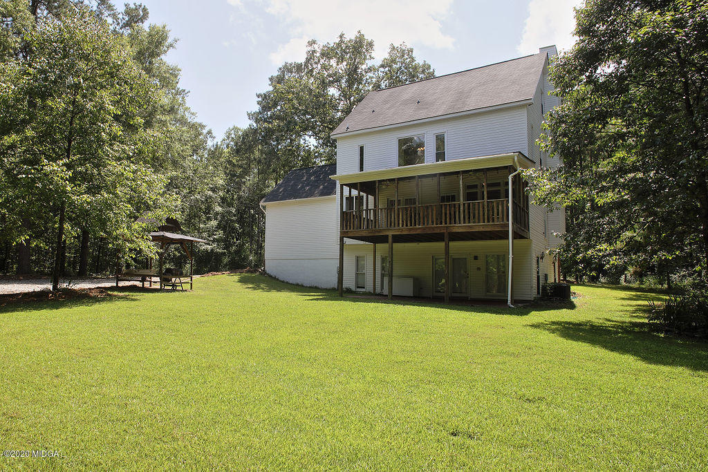 411 Lamar Road Macon, GA 31220 - Photo 18 of 22 a view of a house with a yard