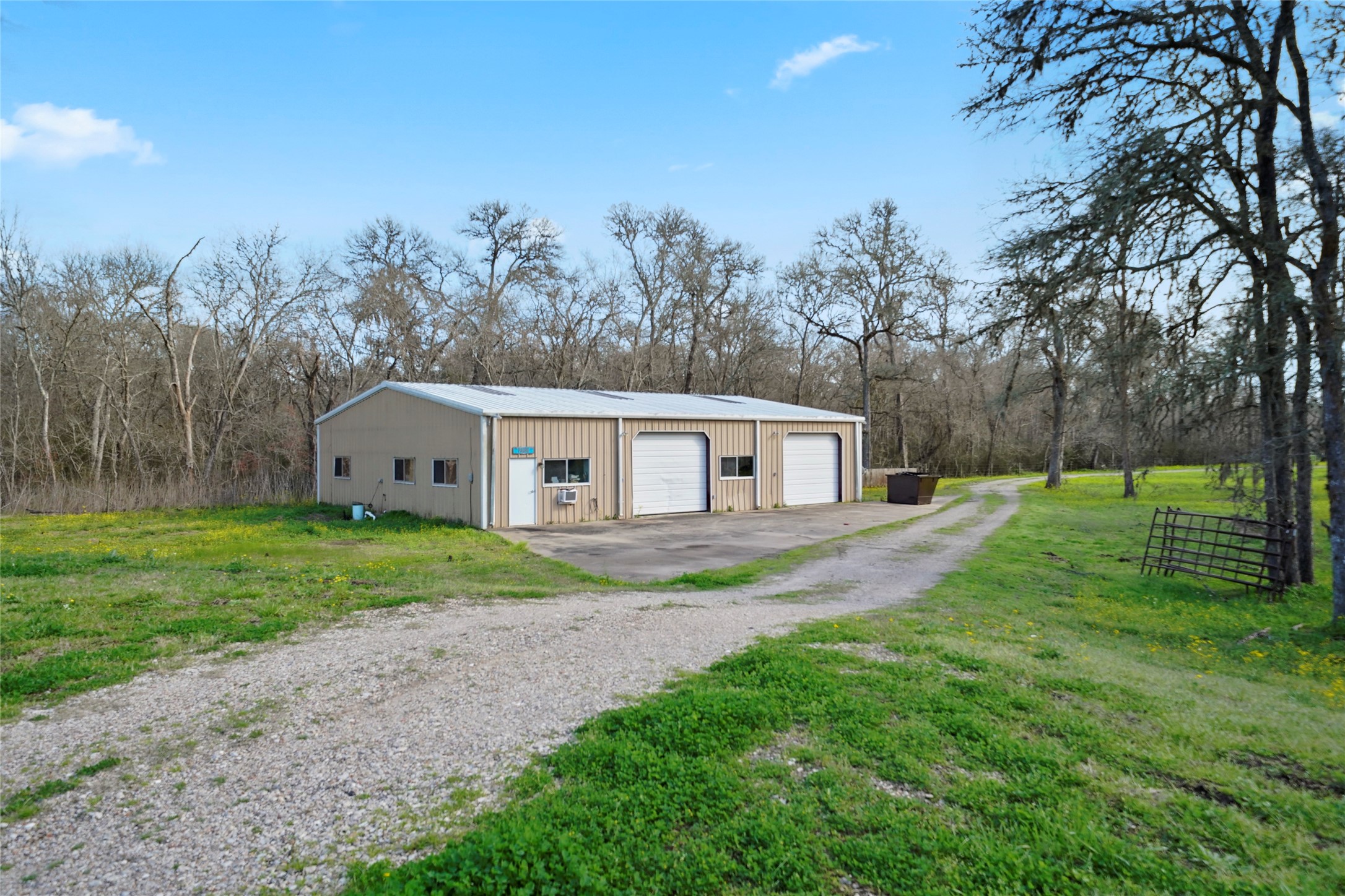 2759 FM 2759 Road Richmond, TX 77469 - Photo 5 of 13 a view of a yard in front of a house with large trees