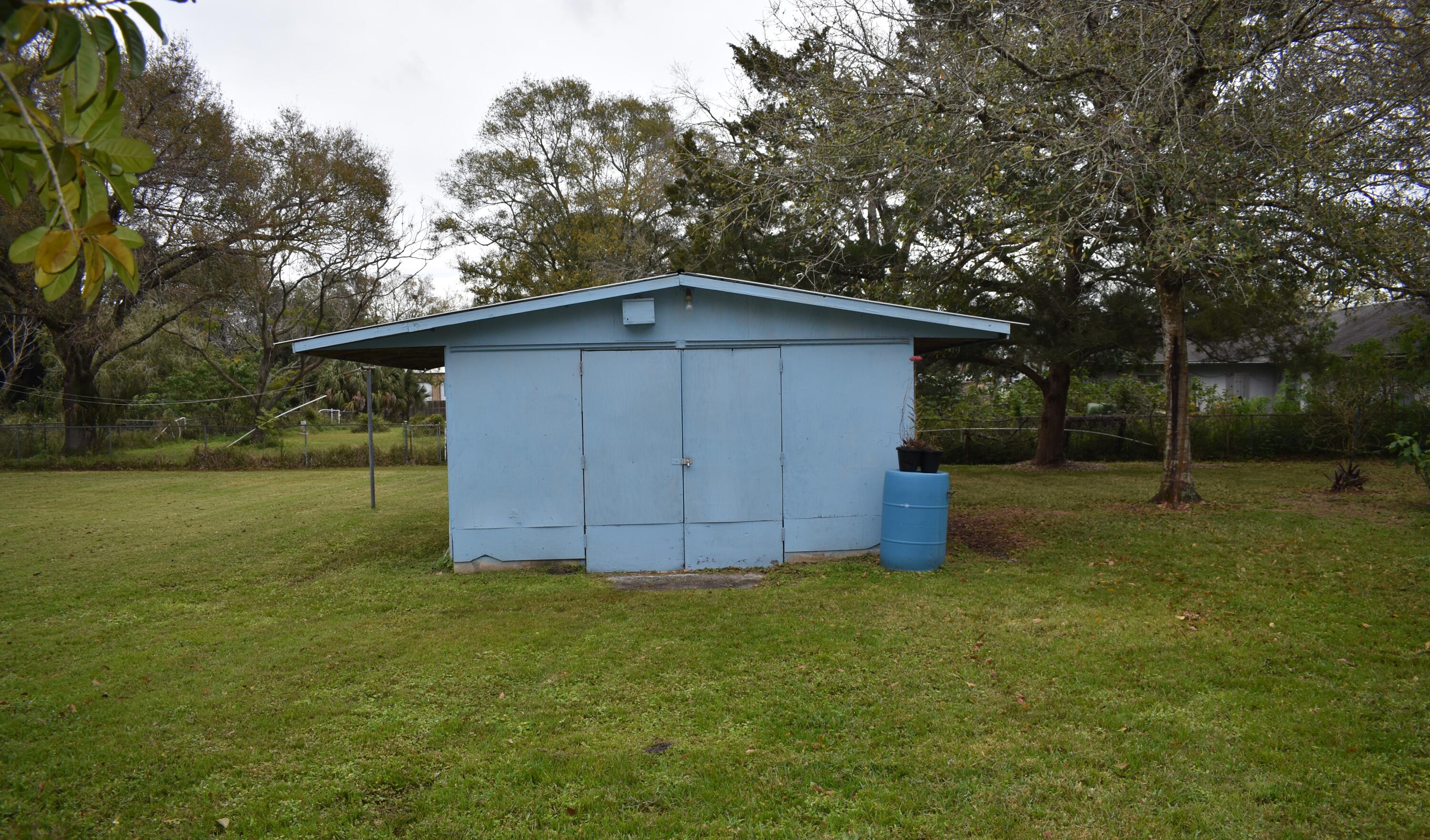 1812 Pinewood Road Melbourne, FL 32934 - Photo 23 of 31 a view of backyard with green space