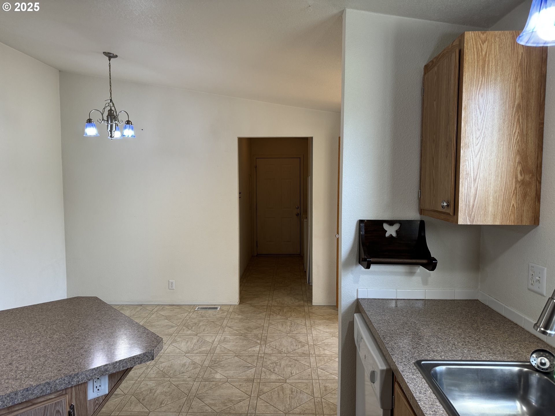 1924 Highway 97 Goldendale, WA 98620 - Photo 16 of 40 a kitchen with stainless steel appliances granite countertop a sink a stove and a refrigerator