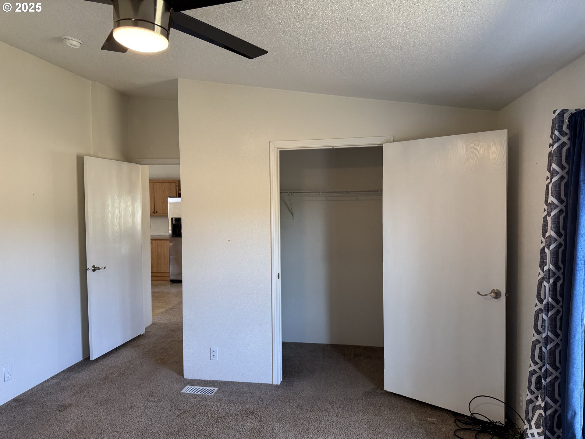 1924 Highway 97 Goldendale, WA 98620 - Photo 18 of 40 an empty room with closet and a ceiling fan