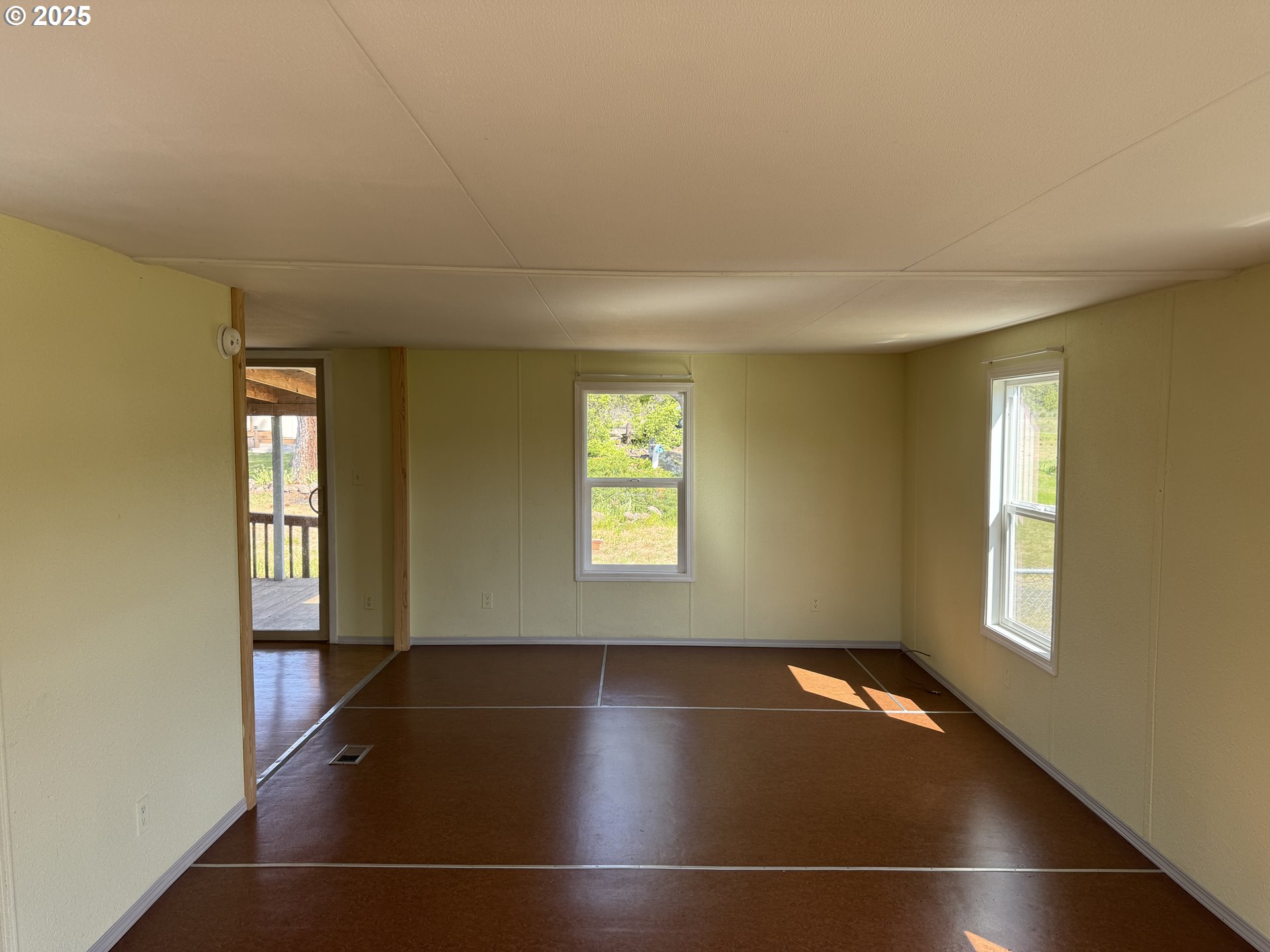 1924 Highway 97 Goldendale, WA 98620 - Photo 26 of 40 an empty room with wooden floor and windows