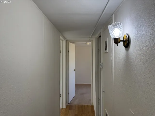 a bathroom with a shower and a sink