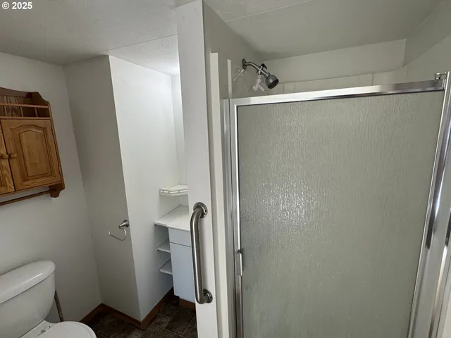 a view of a lake with houses in the background