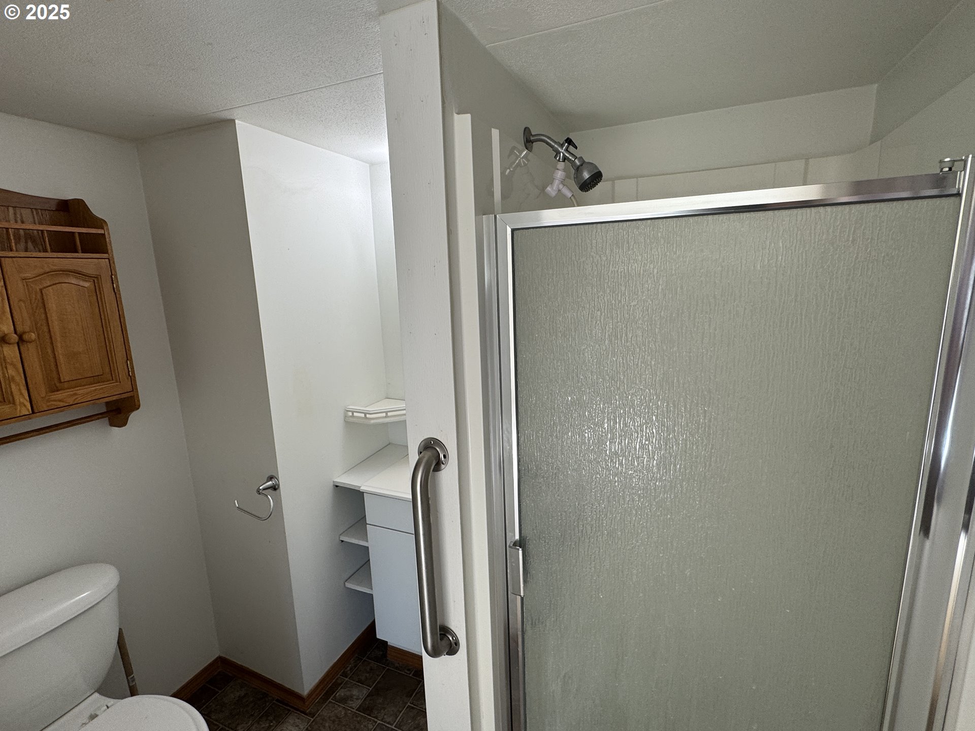1924 Highway 97 Goldendale, WA 98620 - Photo 34 of 40 a bathroom with a shower and a toilet