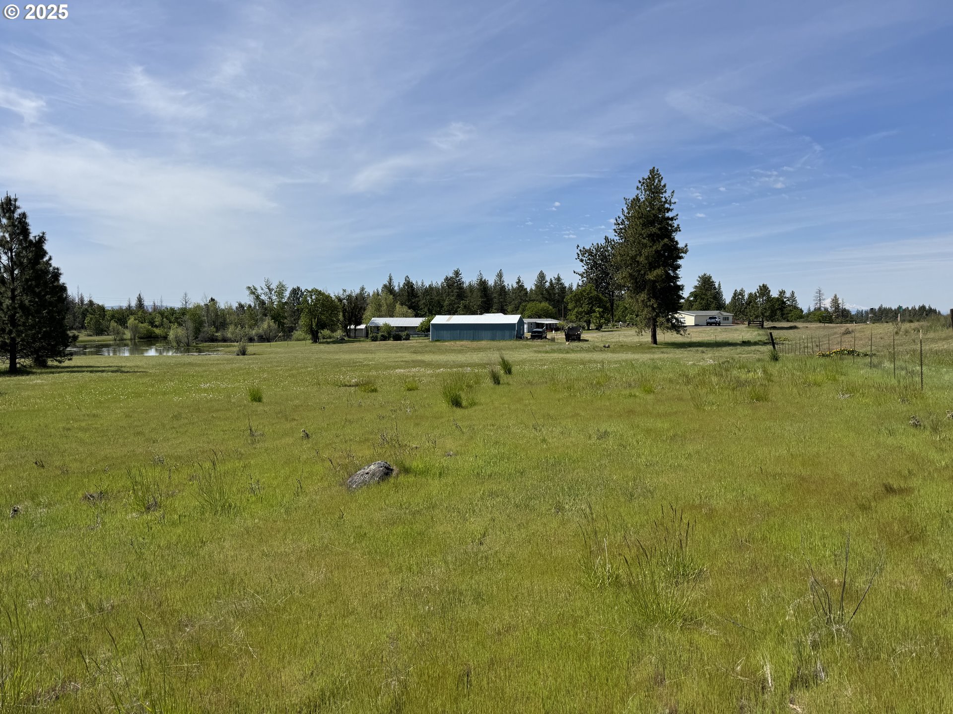 1924 Highway 97 Goldendale, WA 98620 - Photo 36 of 40 a view of a lake with houses in the background