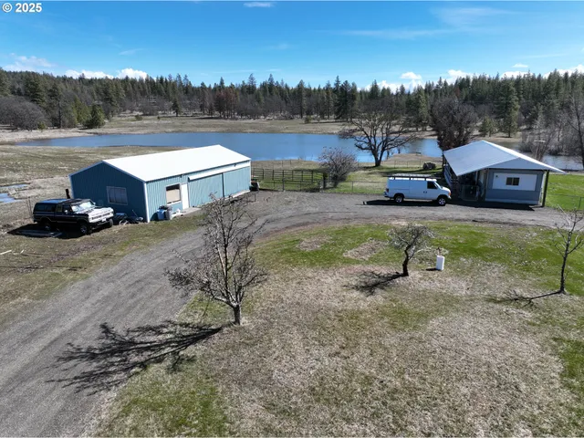 a view of house with outdoor space and sitting area