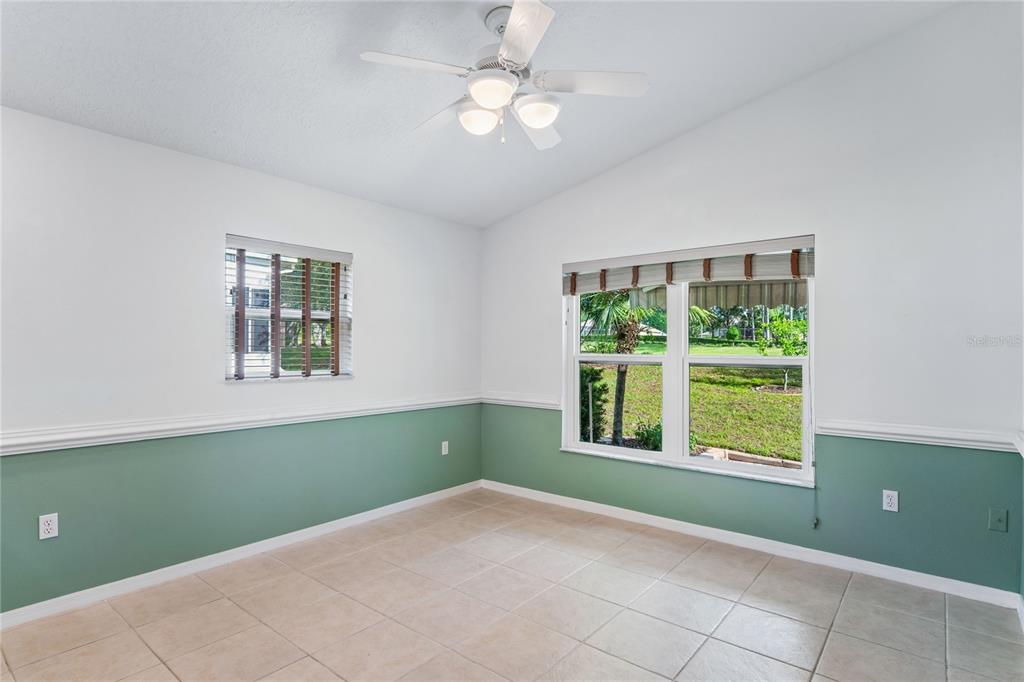 11330 Leeds Drive Spring Hill, FL 34609 - Photo 14 of 78 a view of an empty room with a window and a ceiling fan