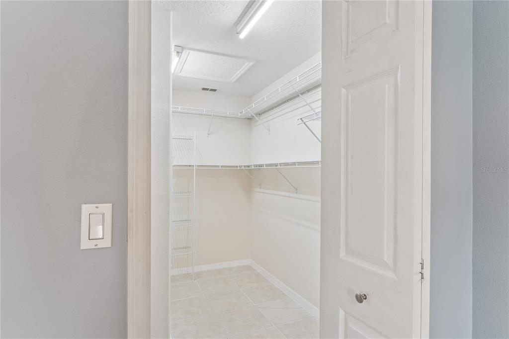 11330 Leeds Drive Spring Hill, FL 34609 - Photo 20 of 78 a bathroom with a glass shower door