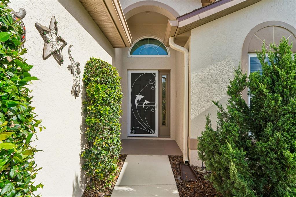 11330 Leeds Drive Spring Hill, FL 34609 - Photo 2 of 78 a front view of a house with garden