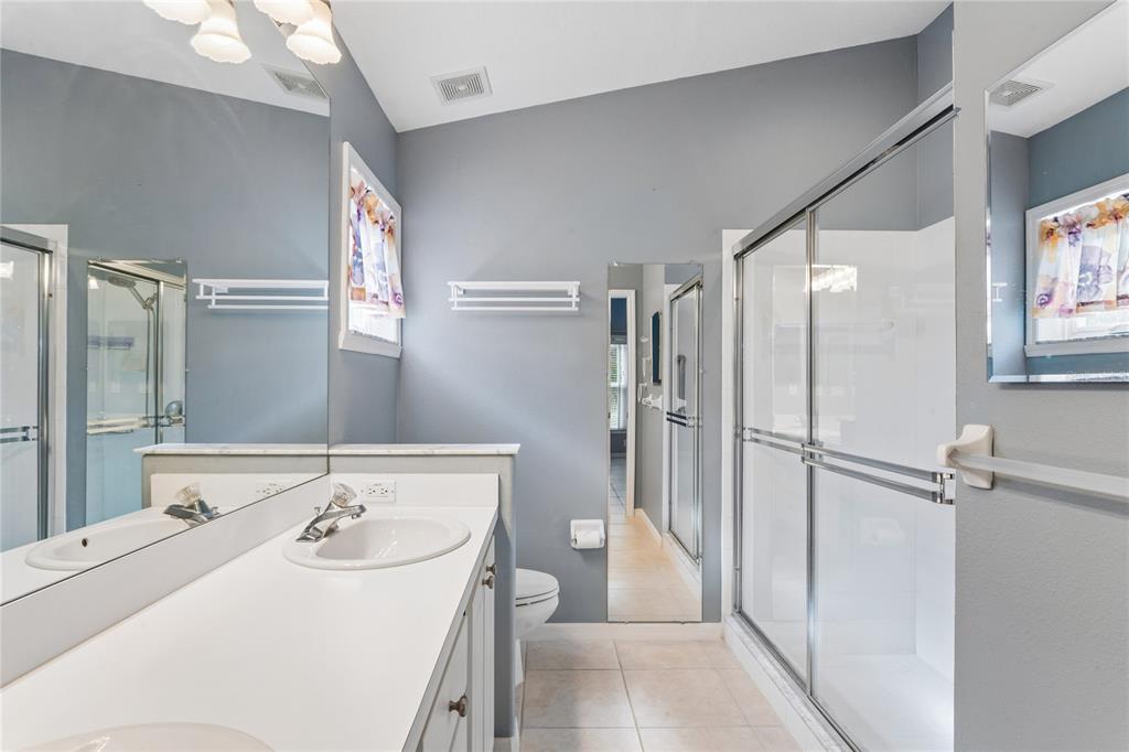 11330 Leeds Drive Spring Hill, FL 34609 - Photo 22 of 78 a bathroom with a sink toilet and shower