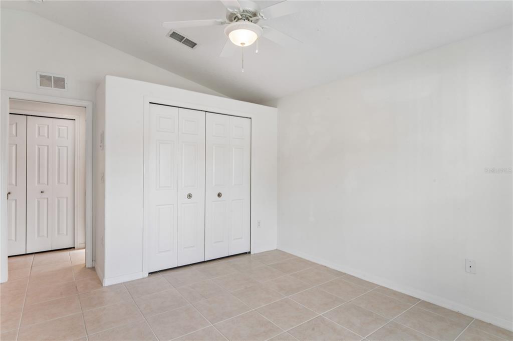11330 Leeds Drive Spring Hill, FL 34609 - Photo 25 of 78 a view of an empty room and a ceiling fan