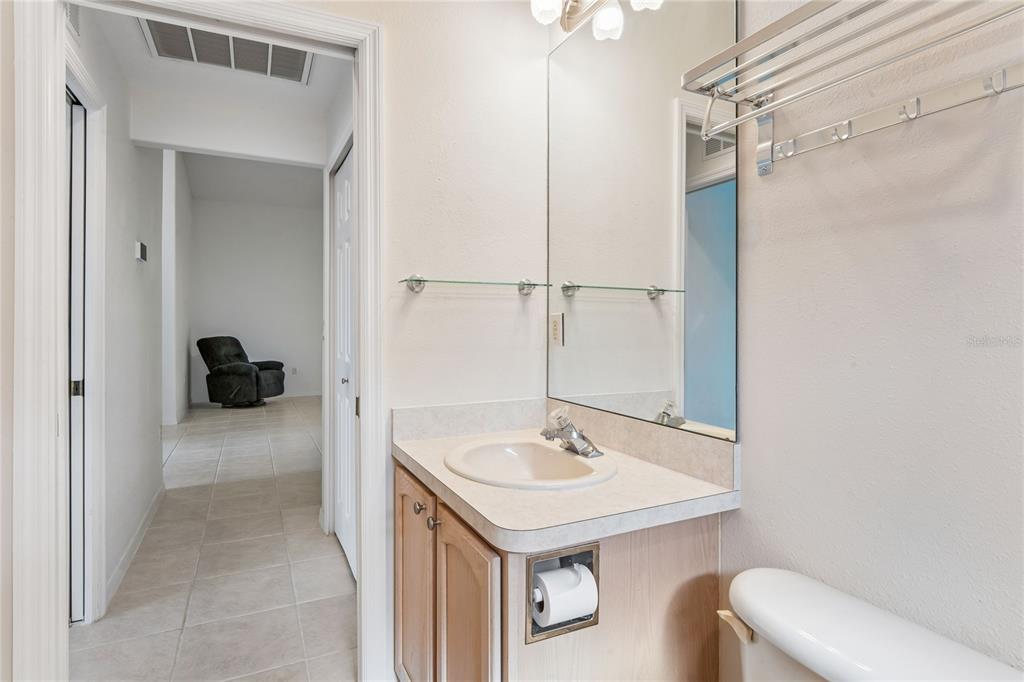 11330 Leeds Drive Spring Hill, FL 34609 - Photo 29 of 78 a bathroom with a sink a toilet and shower